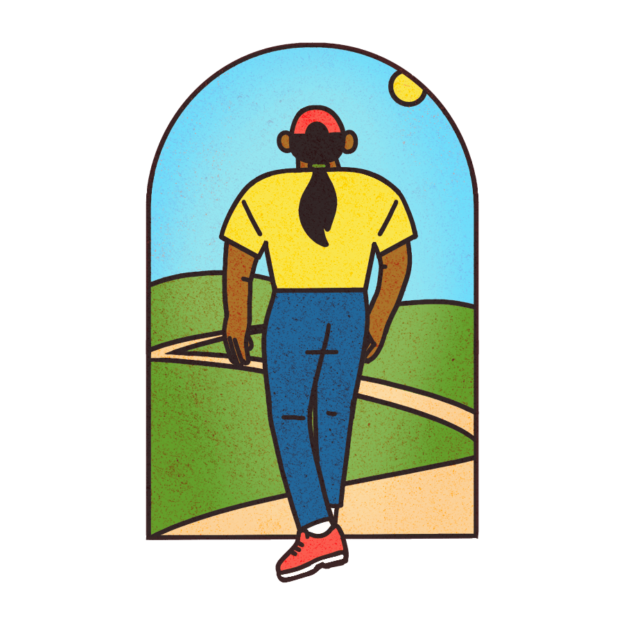 A woman walks through a doorway leading to a path outside.