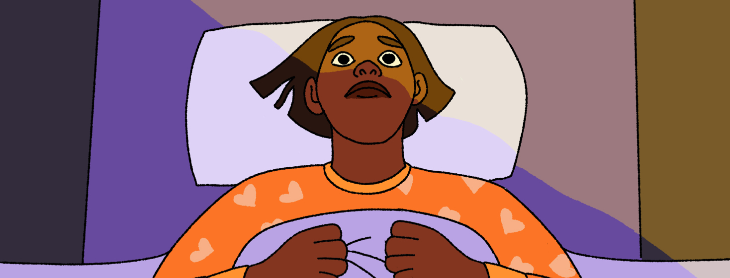 A person wide awake in bed